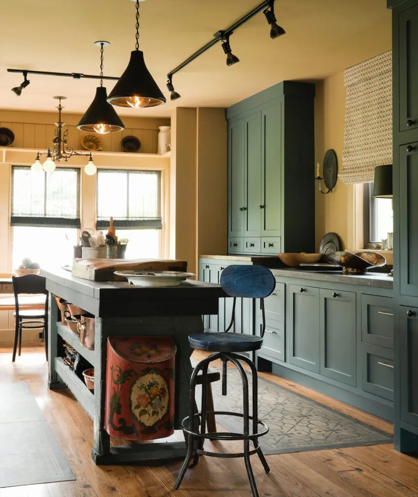  Jill Brown designed the Shaker-style kitchen cabinets. The countertops are bluestone from Belgium. Light fixtures from Brown House and Wares. (Photo by Jack Thompson)