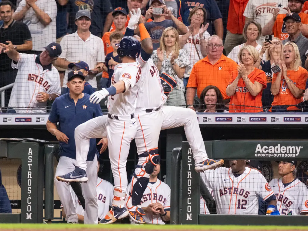 Alex Bregman and Martin Maldonado know how to celebrate big moments. They produce plenty of them. (Photo by F. Carter Smith)