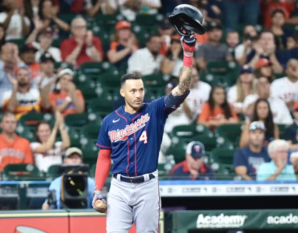 Carlos Correa tips his helmet as the fans at Minute Maid Park give him a standing ovation in his Houston return. (Photo by F. Carter Smith)