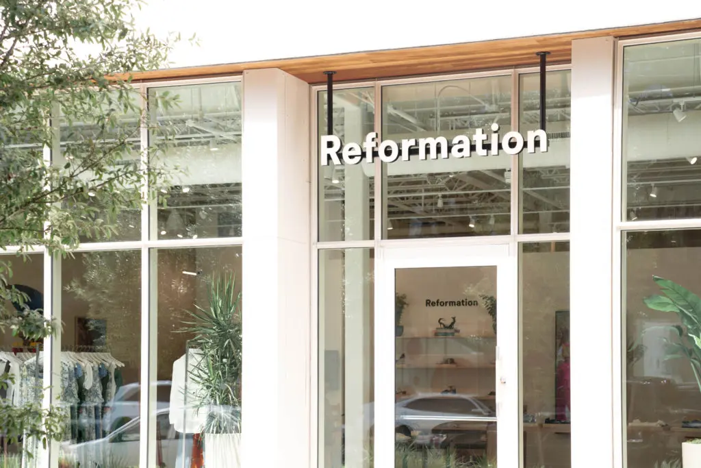 The sleek store incorporates natural and recyclable materials.