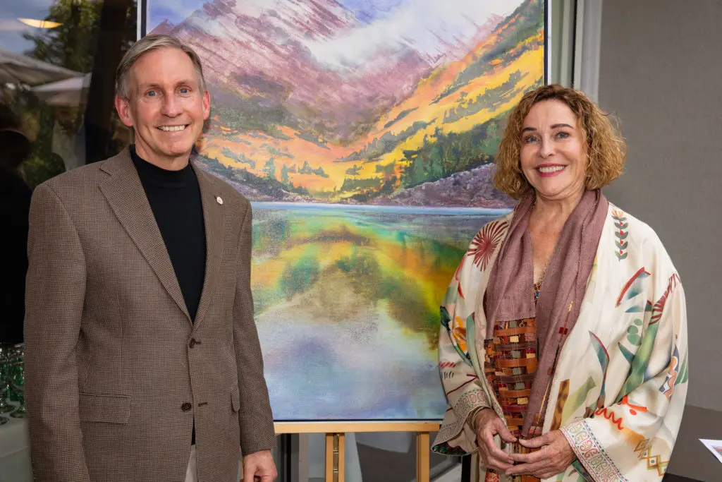 MD Anderson president Dr. Peter WT Pisters Barbara Hines with her painting auctioned off at the MD Anderson Cancer Center events  in Aspen.