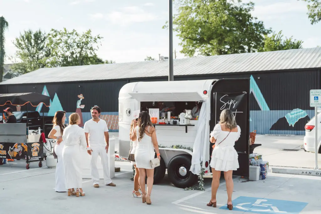 The Wild Pony Express bar was part of the  fun at the Nan & Company Properties White Linen Night in The Heights party. (Photo by Nan Studios)