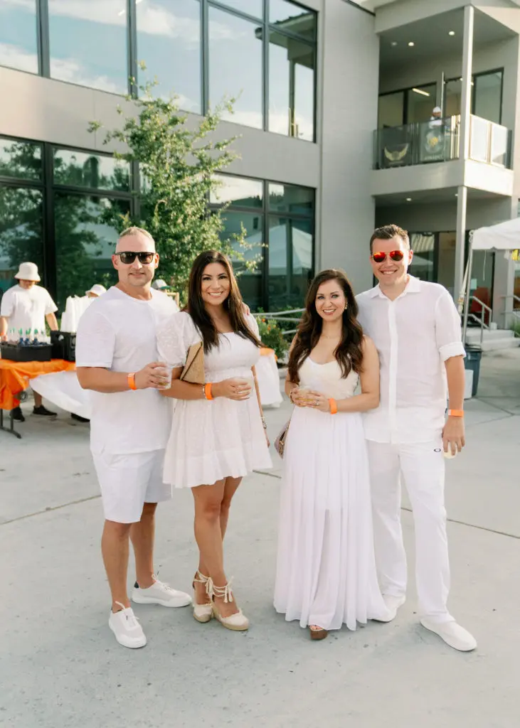 Tyler & Nikki Hohman, Alana & Michael Adams at the Nan & Company Properties party held during White Linen Night in The Heights. (Photo by Nan Studios)