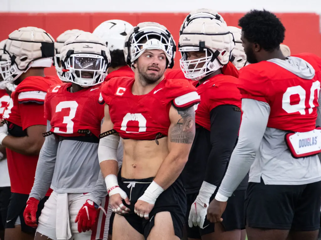 Derek Parish (center) is one of the more unique and interesting players in all of college football. (Photo by F. Carter Smith)