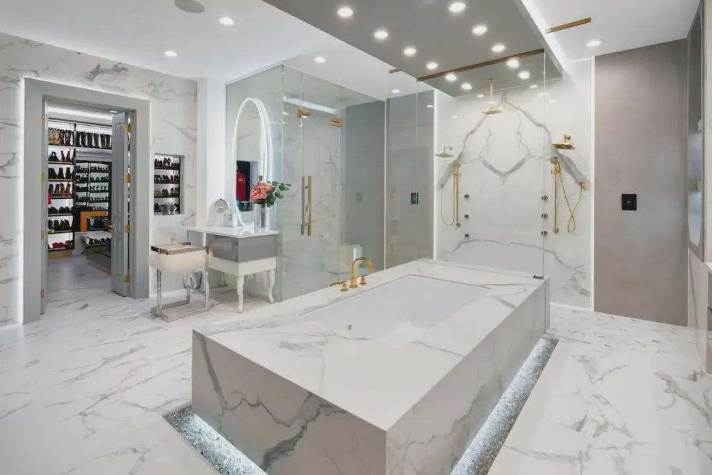 Fire glass surrounds the master bathroom's freestanding tub. 