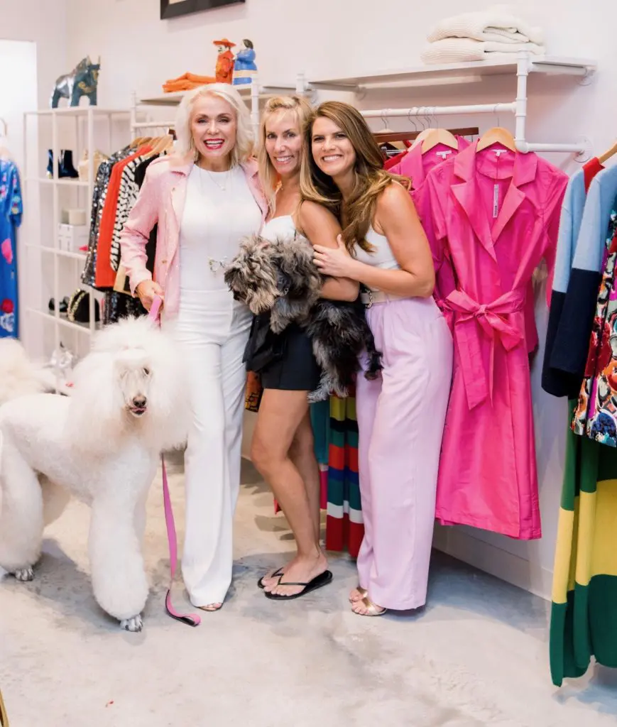Mary Ann Hebrank with poodle Bella, Natalie Naifeh with Jax, Abigail Hartland at the Frances Valentine first anniversary party