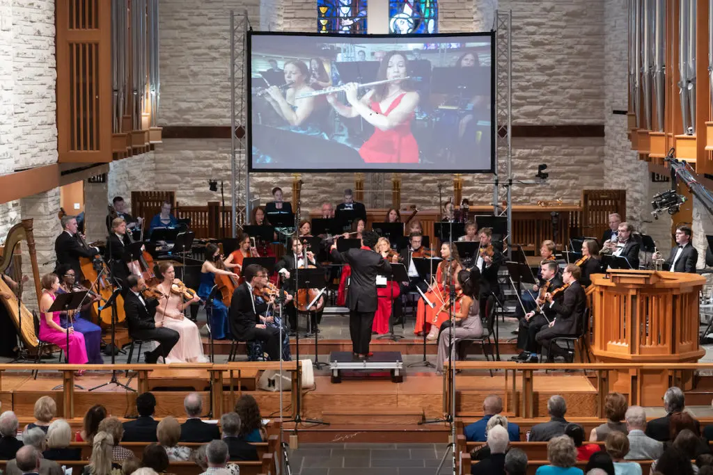 Mei Ann Chen conducting the ROCO orchestra during the Revelry gala concert at The Church of St. John the Divine. (Photo by Daniel Ortiz)