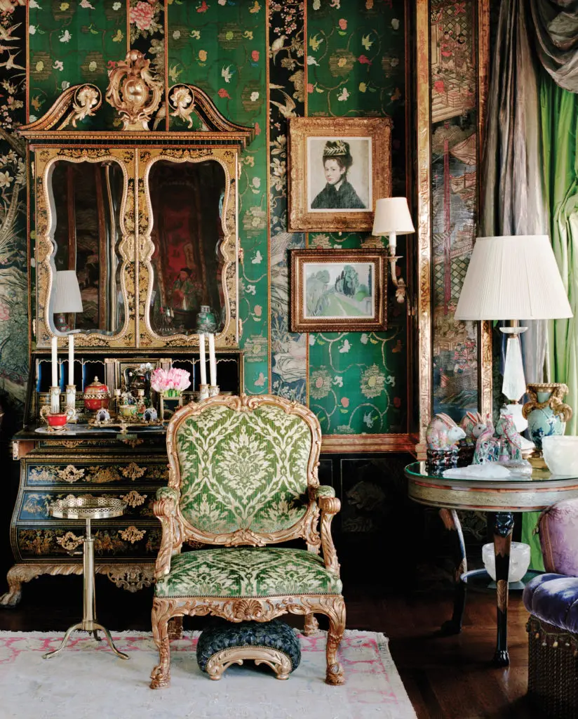 The circa-1740 green- and gold-japanned and carved giltwood
cabinet is attributed to Giles Grendey, one of the greatest 18th-century English cabinetmakers. It's crowned with a swan-neck molded pediment centered by a pierced, carved giltwood cartouche and a baroque cabochon. On the right, "Buste de Femme au Chapeau à Plumes," 1887, by Edgar Degas. (Photography by Lisa Romerein)