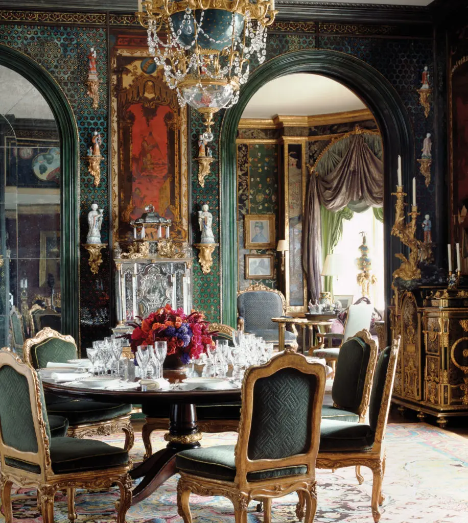 Guests gather for drinks in the living room and then enter the dining room, here set for a fall dinner honoring illustrious scientists. The Getty family’s Animalier dinner service was made in 1810 for the King of Holland. Eight Louis XV gilt chairs by Foliot circle the Regency-style dining table. (Photography by Lisa Romerein)