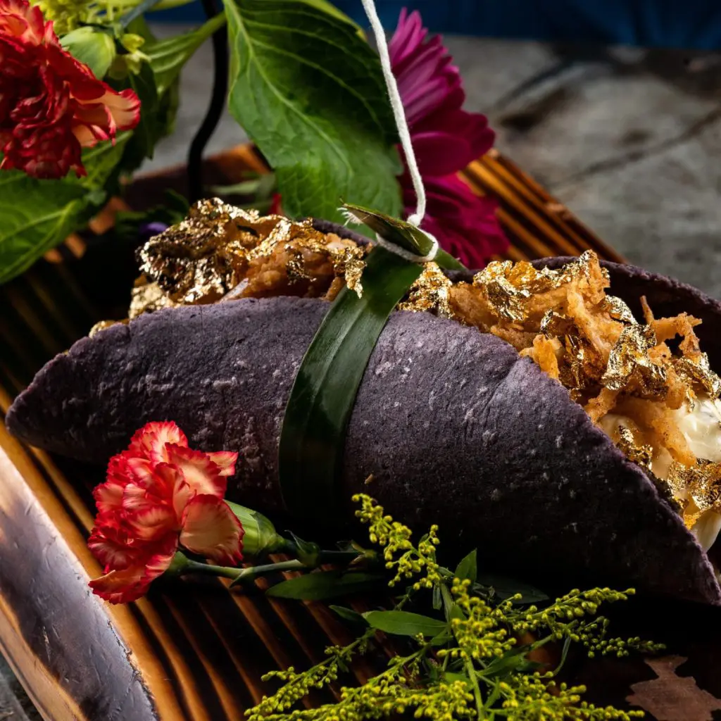 The 24Karne taco at La Neta includes 24K gold, grilled skirt steak, and truffle cheese fondue. (Courtesy)