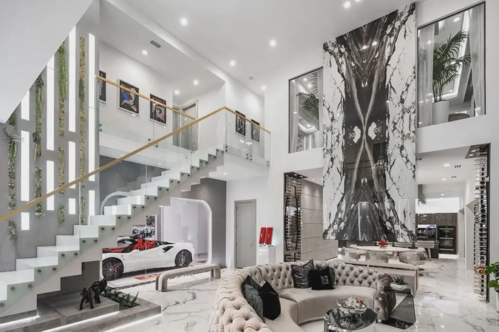 The great room is filled with Italian porcelain tile and custom furnishings by  homeowner Michael Shaun Jackson. 