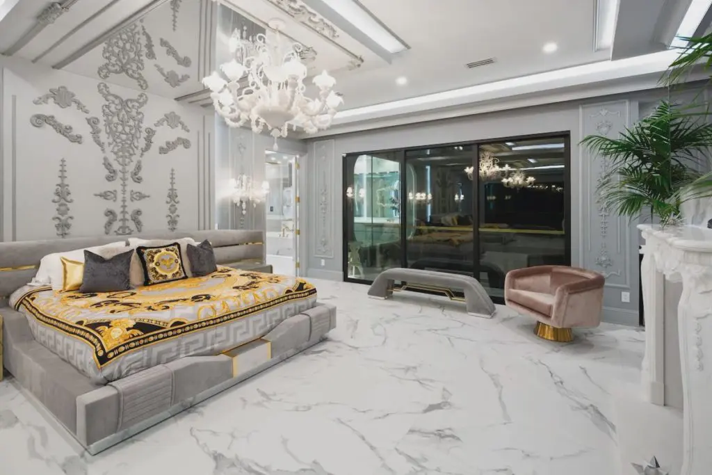 The main bedroom takes its aesthetic cues from the Versace mansion. 