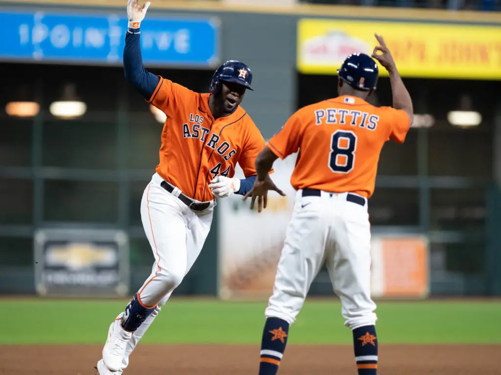 When Yordan Alvarez hit his third home run of the night, he and Astros third base coach Gary Pettis had quite the moment. (Photo by F. Carter Smith)
