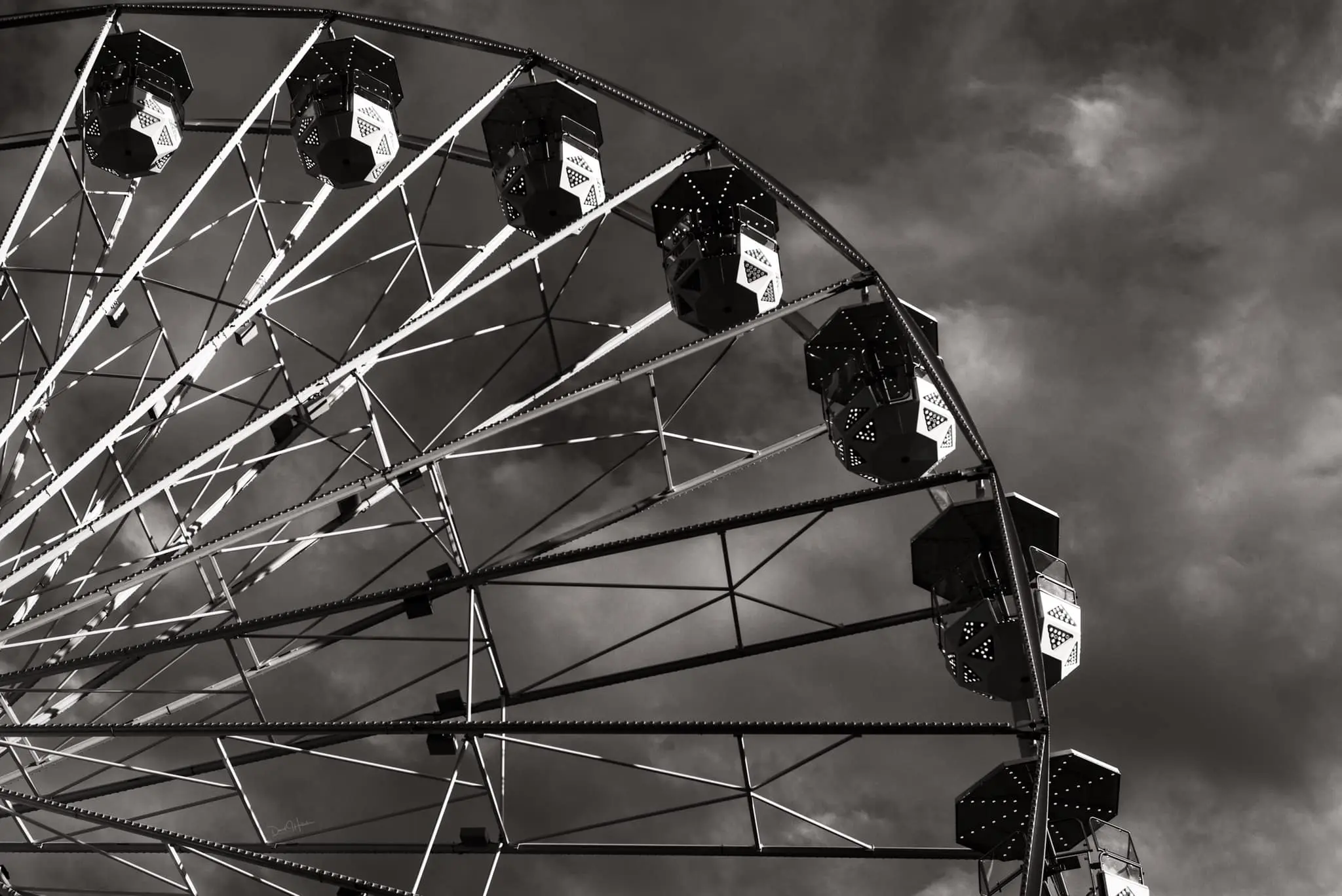 This black and white photograph of the Ferris wheel at the Fort Worth Stock Show and Rodeo is chef taken. (Photo by David Hollister)