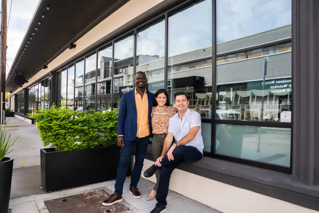 General manager Cherif Mbjodi, with Victoria Bludorn and her husband, chef Aaron Bludorn announcing the upcoming opening of their new eatery, Navy Blue. (Photo by Michael Anthony)