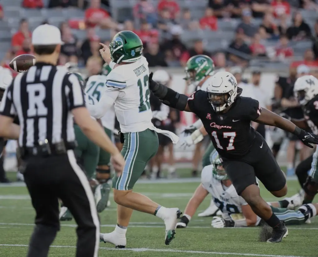 UH tried to put pressure on third string quarterback Kai Horton. (Photo by F. Carter Smith)