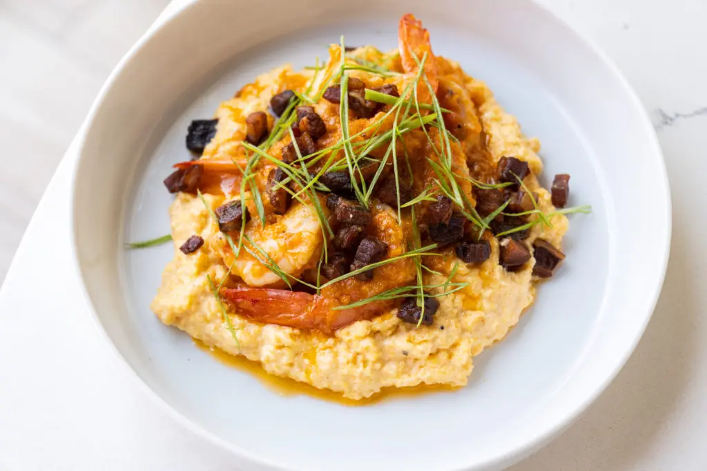 Georgia James popular Shrimp and Grits dish is on the menu upstairs at their new Rooftop Lounge.  (Photo by Michael Anthony)