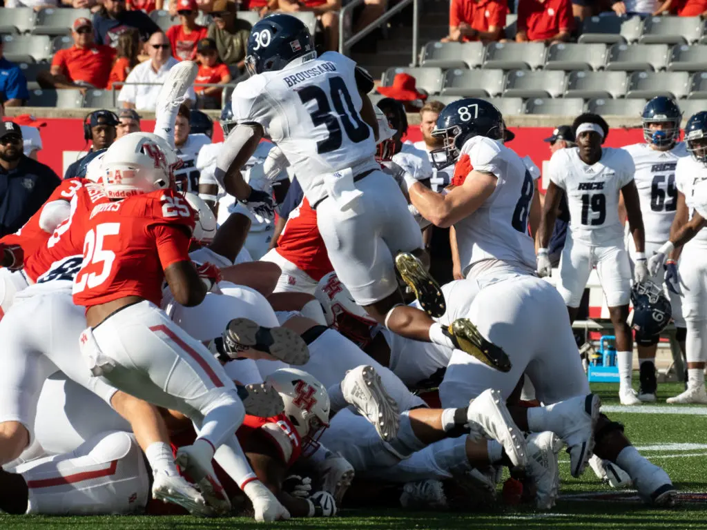 Rice running back Ari Broussard went high for a touchdown.  (Photo by F. Carter Smith)