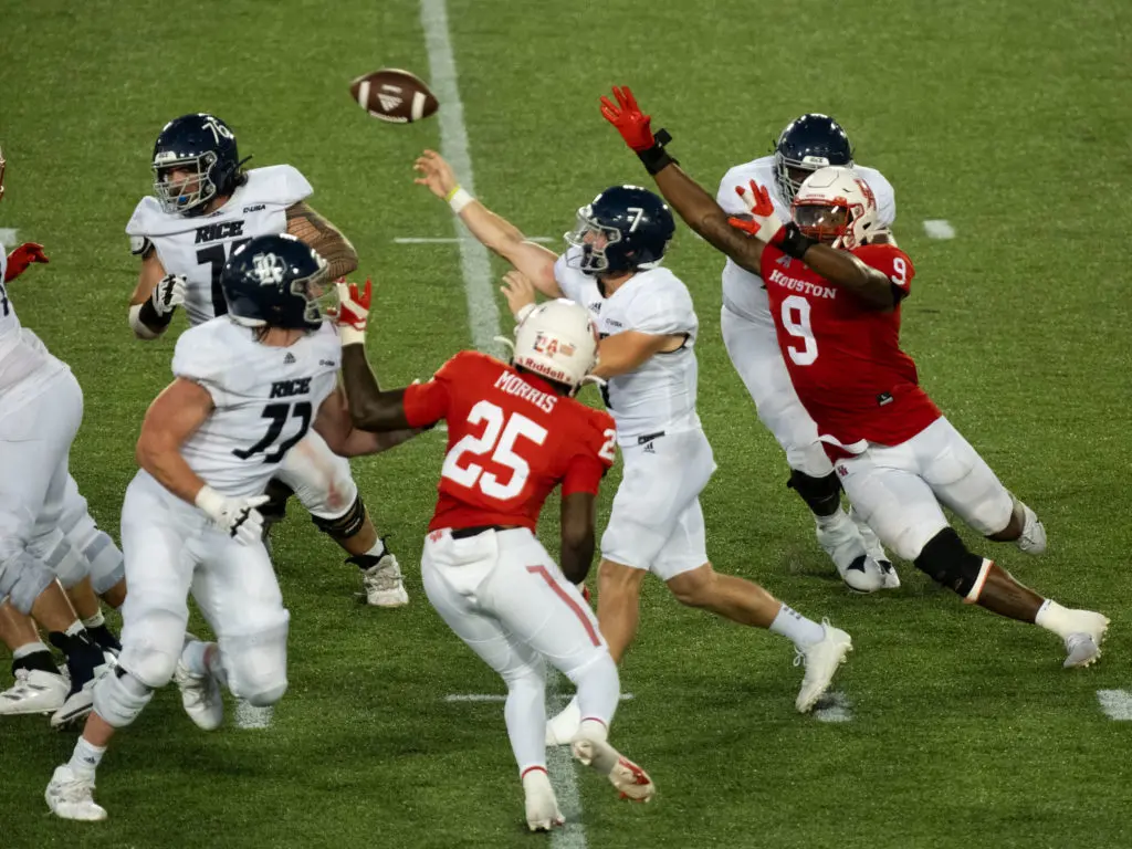 Rice quarterback TJ McMahon did not let Houston's pressure get to him in the Bayou Bucket game.  (Photo by F. Carter Smith)