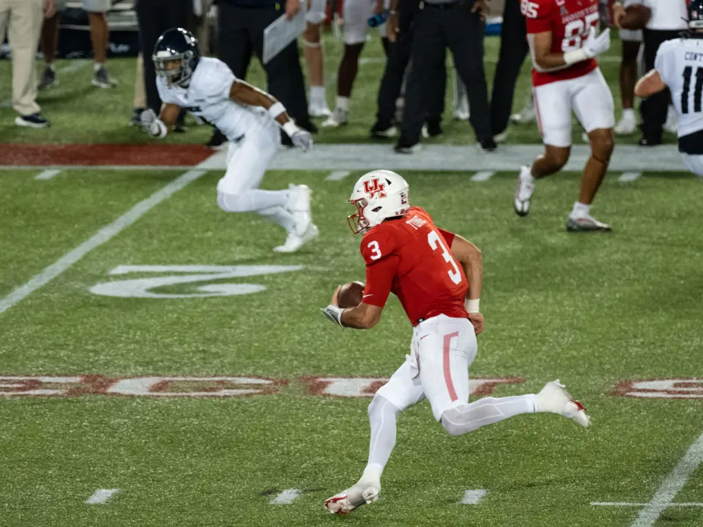 University of Houston quarterback Clayton Tune also makes plays with his legs.  (Photo by F. Carter Smith)