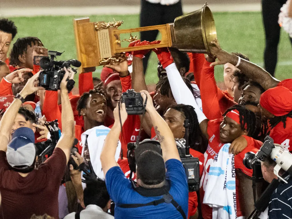 In the end, the UH players raised the Bayou Bucket again.    (Photo by F. Carter Smith)