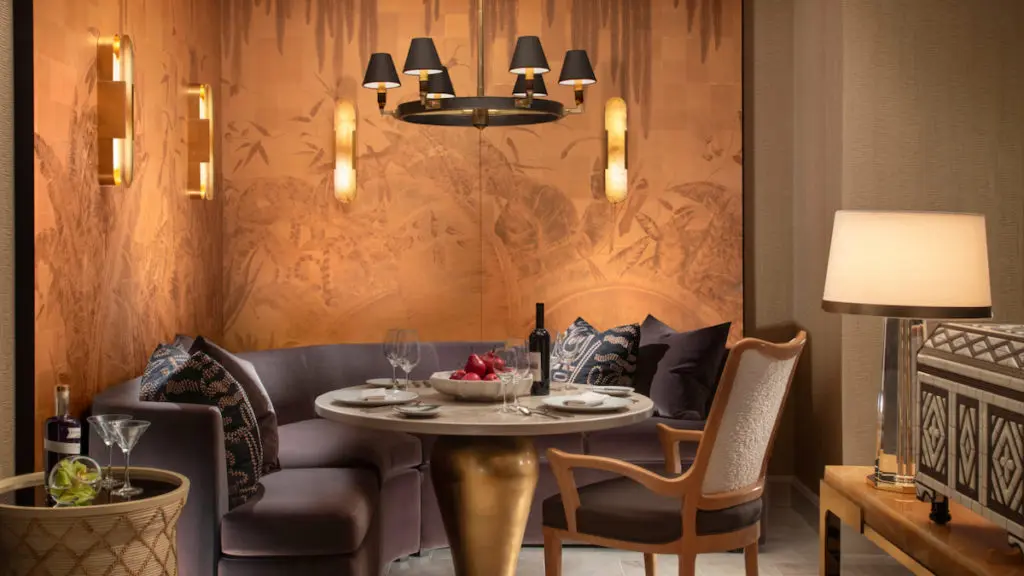 ach room is highlighted by wood accent walls, a range of functional and atmospheric illumination, luxurious textiles and linens, and accents of natural stone, decorative metal, and original artwork. (courtesy of Wynn Las Vegas)