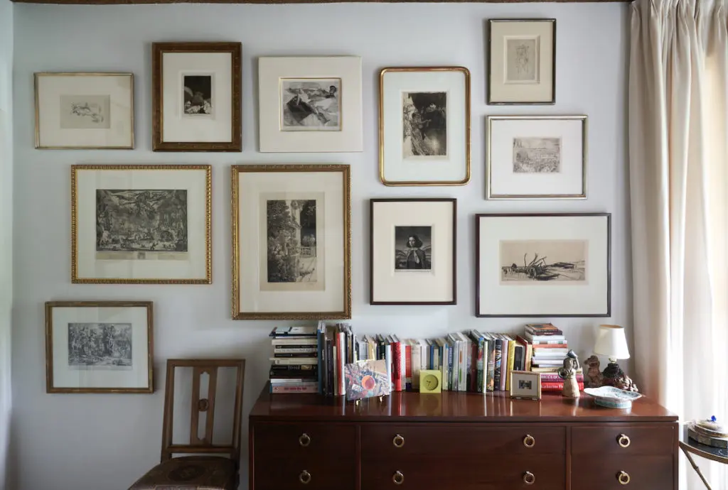 Drawings and fine prints from the 16th to mid-20th centuries rotate along a wall protected from sunlight. Dunbar dresser from Period Modern in San Antonio. (Photo by Pär Bengtsson / art direction by Michelle Aviña)
