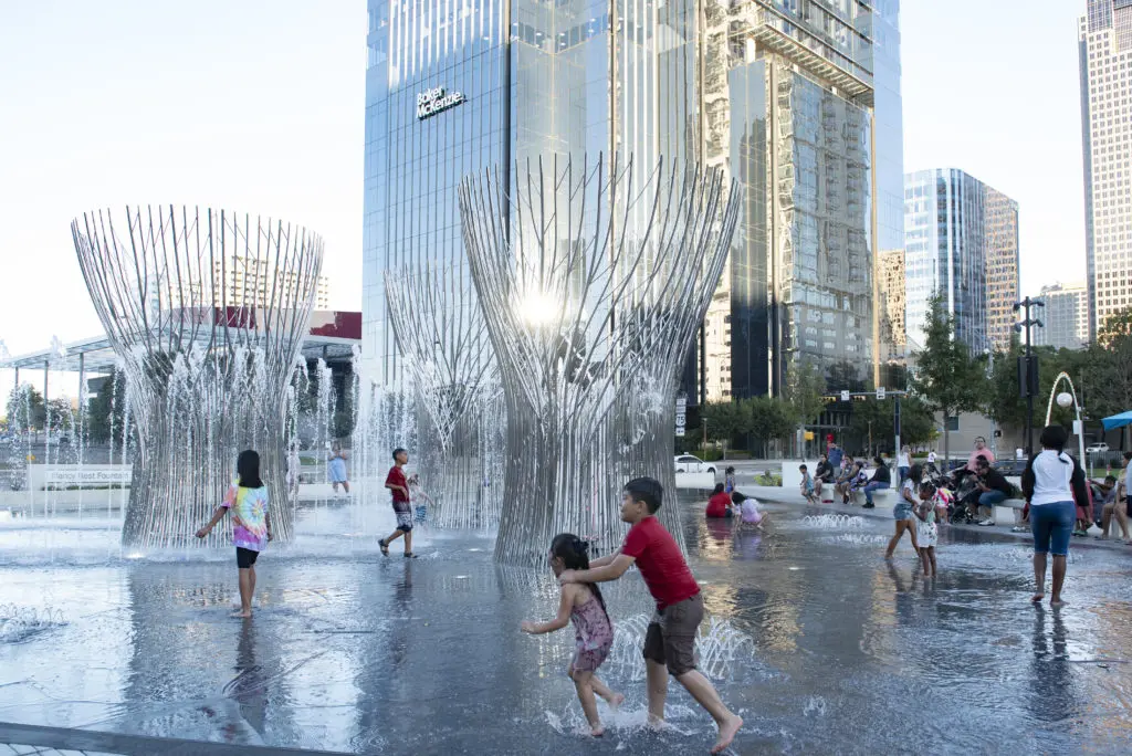 Children enjoyed playing in the fountain (Photo by Tamytha Cameron)