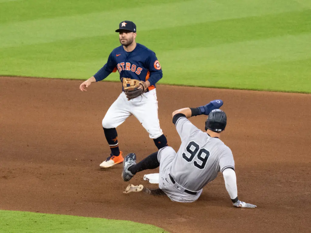 Aaron Judge is having trouble measuring up to Jose Altuve's Astros in another playoff series. (Photo by F. Carter Smith)