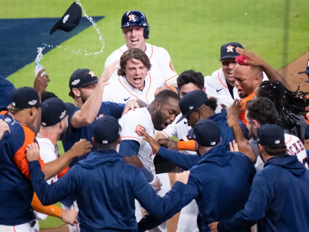 Caps, water bottles and almost everything else went flying after Yordan Alvarez won it with two outs in the bottom of the ninth. (Photo by F. Carter Smith)