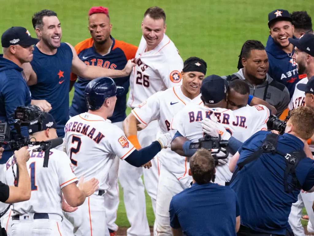 Houston Astros manager Dusty Baker wrapped Yordan Alvarez up in a hug after the young superstar stunned the Seattle Mariners. (Photo by F. Carter Smith)