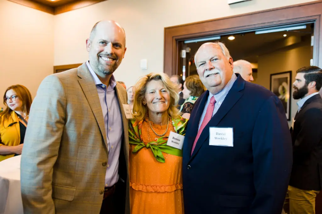 Chris Weekley, honorees Bonnie & David Weekley at the Memorial Assistance Ministries annual luncheon.