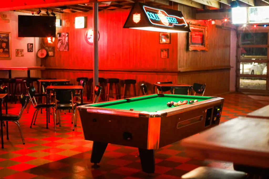 What's a neighborhood bar without  a pool table? Check out the one at EZ's Liquor Lounge just next door to Coltivare. (Photo by Mikah Danae)