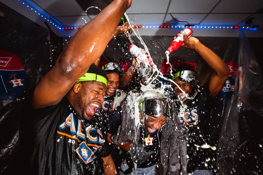 The Astros turned the visiting clubhouse into a wild party scene after beating the Mariners 1-0 in 18 innings to advance to another American League Championship Series. (@Astros)