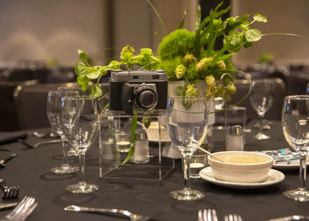 Elegant tablescapes were accessorized with authentic vintage cameras at the FotoFest Fine Print Auction. (Photo by Tere Garcia)