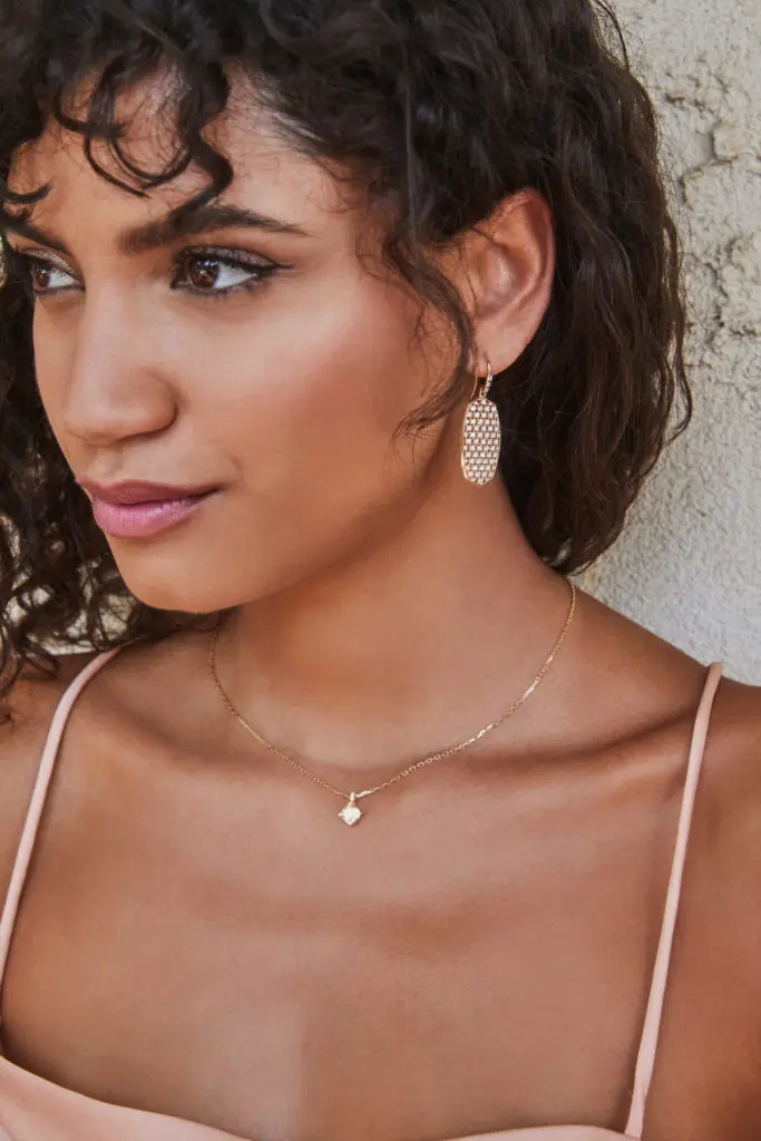 Kendra Scott's limited edition, 20th anniversary release includes earrings and a necklace made with 14-karat gold. 