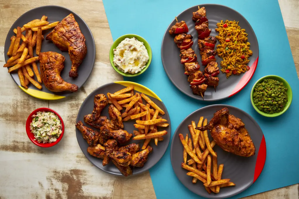 Nando's famed chicken dishes from left to right: flame-grilled peri-peri double chicken leg, wings, skewers and ¼ chicken breast. (Photo by Ricardo Franco)