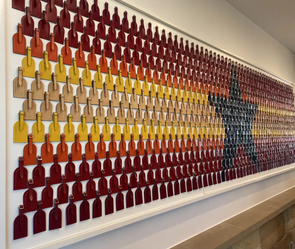 Artwork featuring Louis Vuitton's classic luggage tags. Photo by Courtney Dabney.