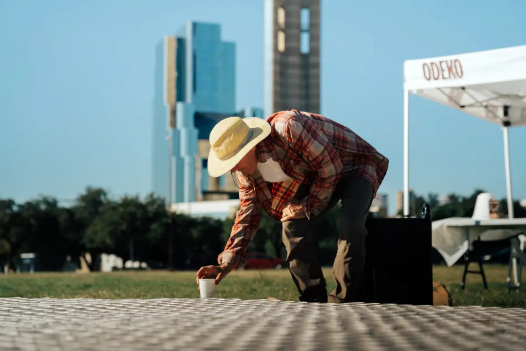 Dallas muralist Kyle Wadsworth puts on the finishing touches to his live art display for Odeko coffee.