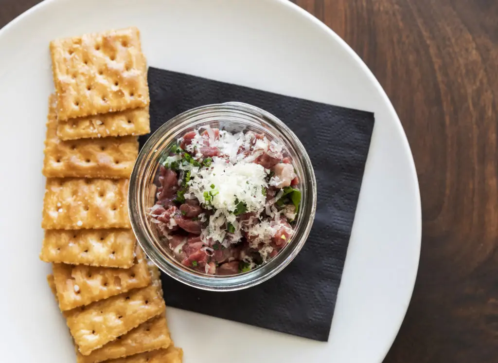 Steak Tartare has a long history in Medina County thanks to the French immigrants who settled there. Here the dish is reimagined  by chef Nick Fine at Houston's new Wild Oats restaurant. (Photo by Claudia Casbarian)
