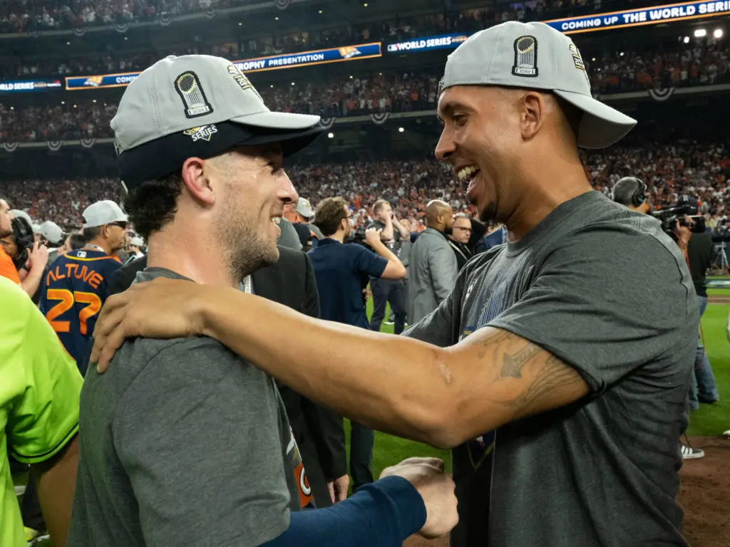 Alex Bregman and injured Astros vet Michael Brantley shared a moment. Brantley didn't play a minute in these playoffs, but he still helped turn around the Astros season with his speech in Philadelphia. (Photo by F. Carter Smith)