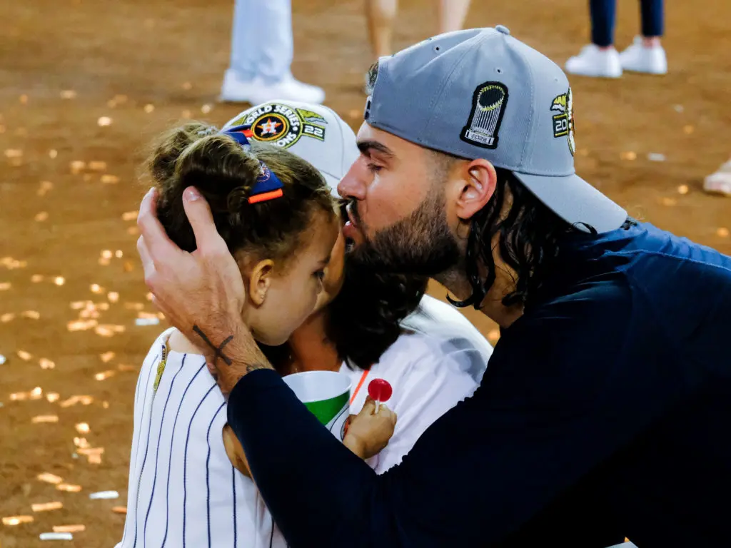 Lance McCullers Jr. gave his 3-year-old daughter Ava a big kiss. (Photo by F. Carter Smith)