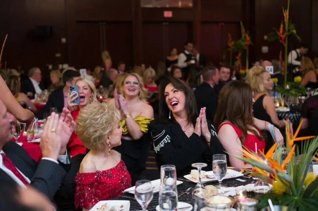 Alicia Smith and table mates, including Margaret Alkek Williams, rock with the HPFA Foundation party. (Photo by Daniel Ortiz)