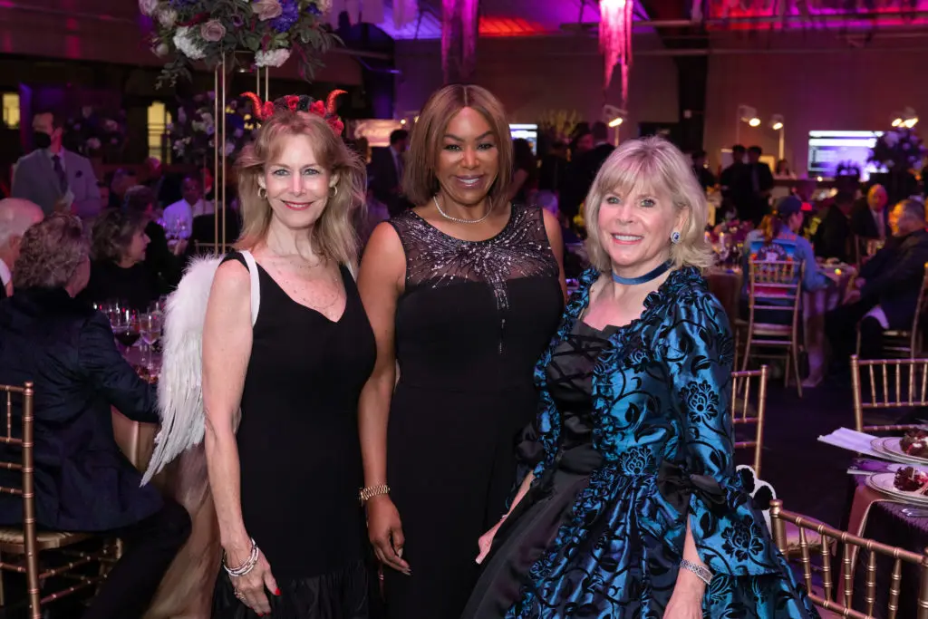 SPCA Howl-O-Ween gala chairs Cheryl Byington and Zane Carruth flank emcee Deborah Duncan at the fête. (Photo by Jacob Power)