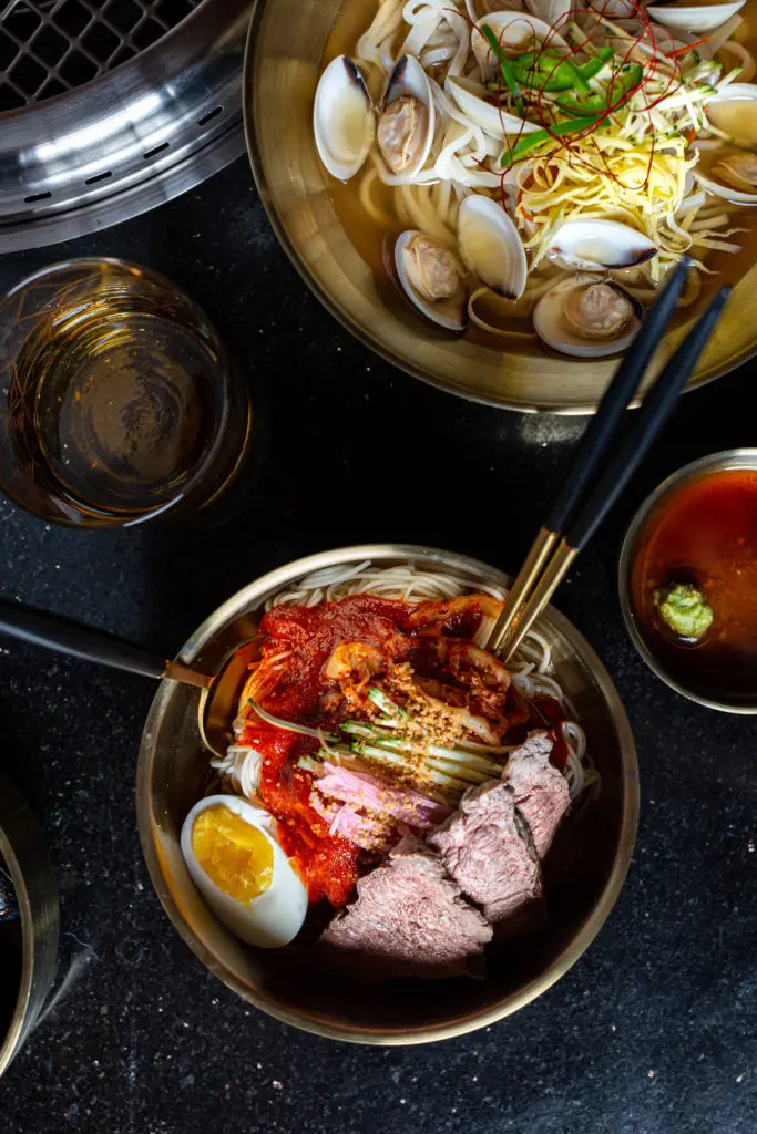 Some of the Korean food served up at Karne Korean include Clam Kal-Guskoo (top) and Bibimp Guksoon (below). (Photo by Jenn Duncan)