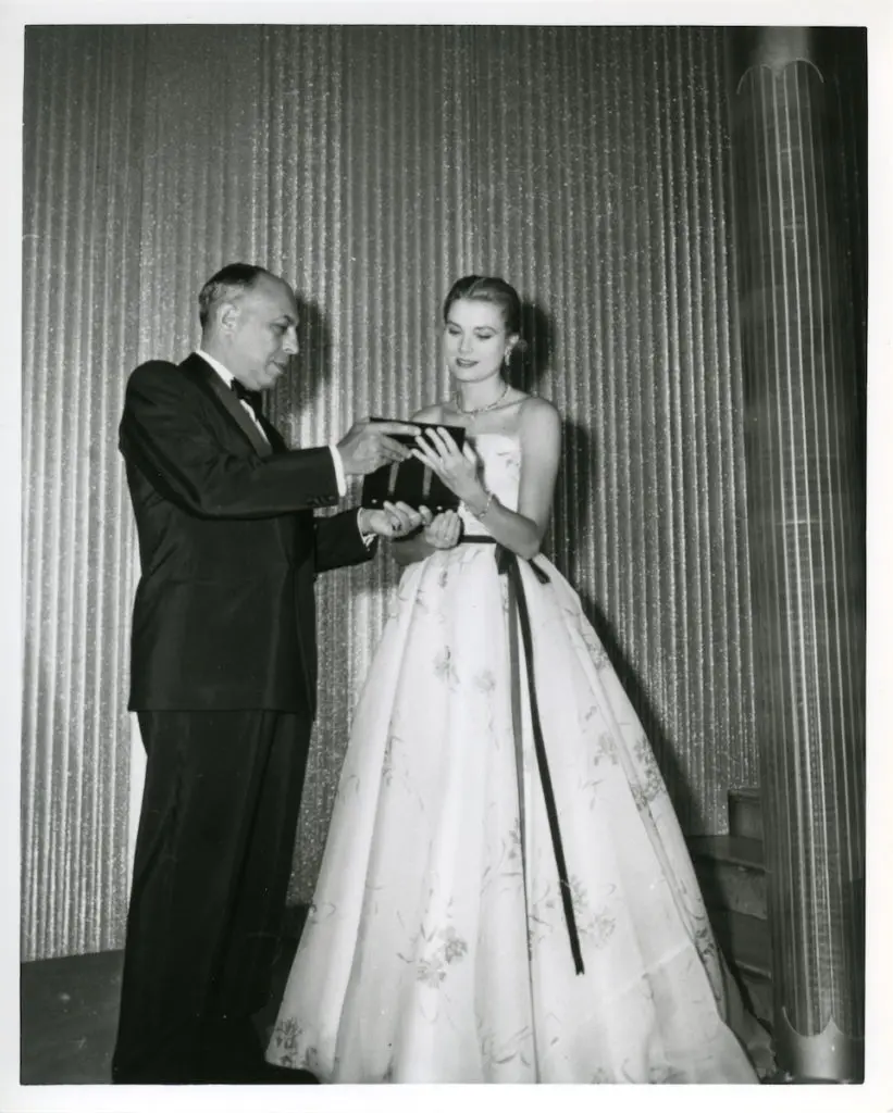 Grace Kelly receiving the Neiman Marcus Fashion Award from Stanley Marcus, 1955 - Courtesy of SMU