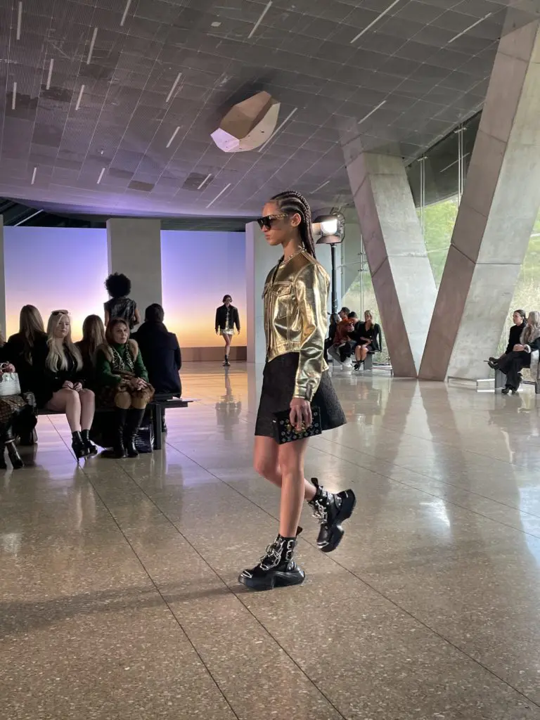 Gilded gold jacket pairs with A-line skirt and boots with chain link embellishment. Photo by Courtney Dabney.
