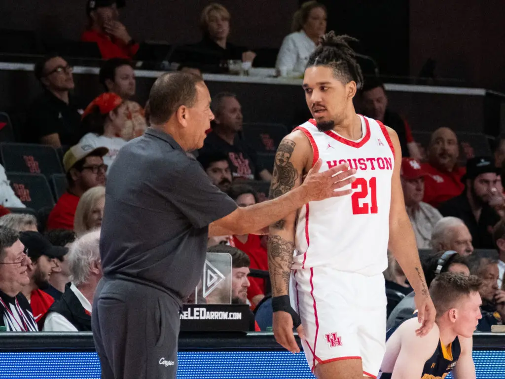 University of Houston coach Kelvin Sampson has some guidance for freshman guard Emanuel Sharp. (Photo by F. Carter Smith)