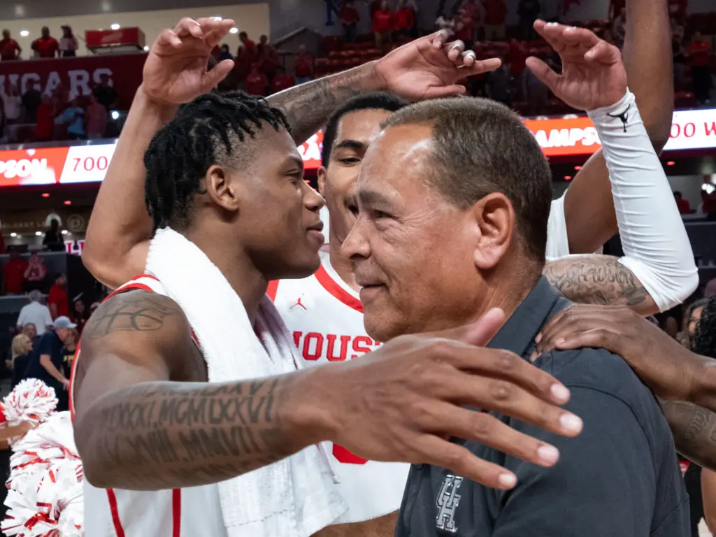 University of Houston coach Kelvin Sampson and his players have a deep bond. Here, they congratulate him on his 700th win earlier this season. (Photo by F. Carter Smith)