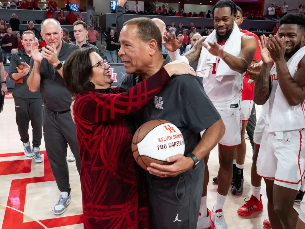 Karen Sampson had a big hug for her husband, University of Houston coach Kelvin Sampson, after he reached 700 wins. (Photo by F. Carter Smith)